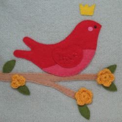 detail of red bird applique